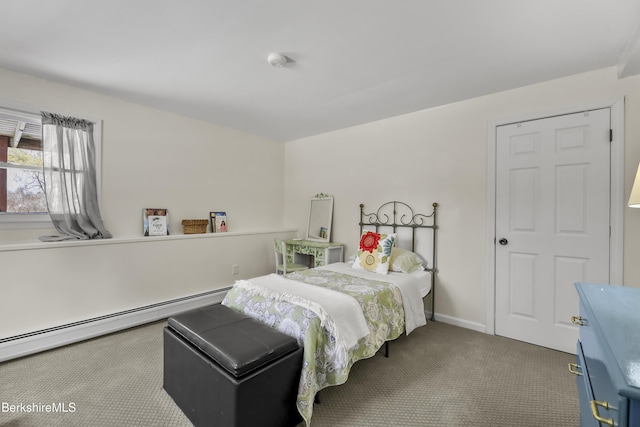 bedroom featuring a baseboard radiator and carpet