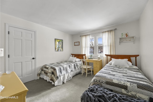 bedroom featuring dark carpet