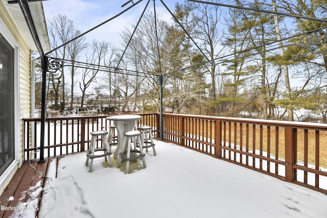 view of snow covered deck