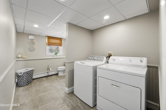 washroom featuring baseboard heating and independent washer and dryer