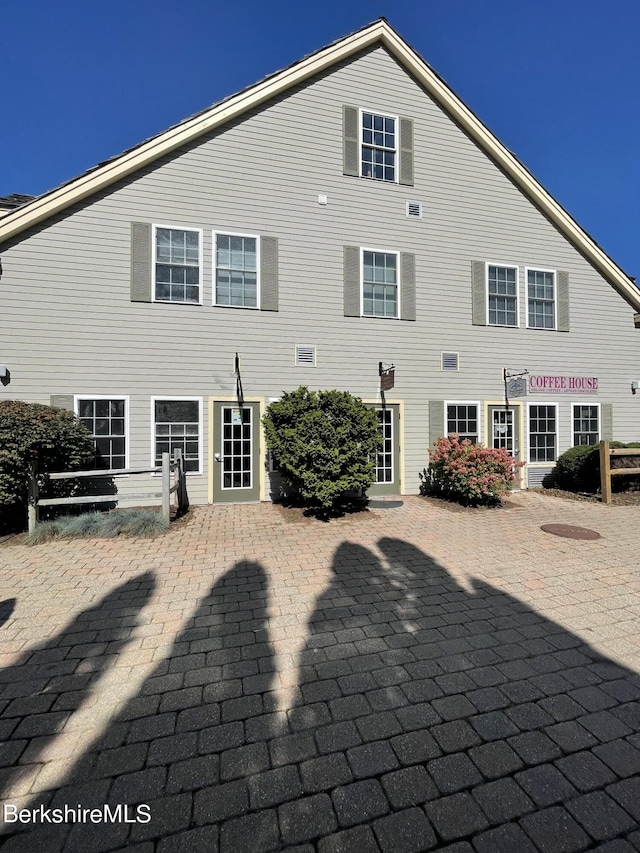 rear view of house featuring a patio