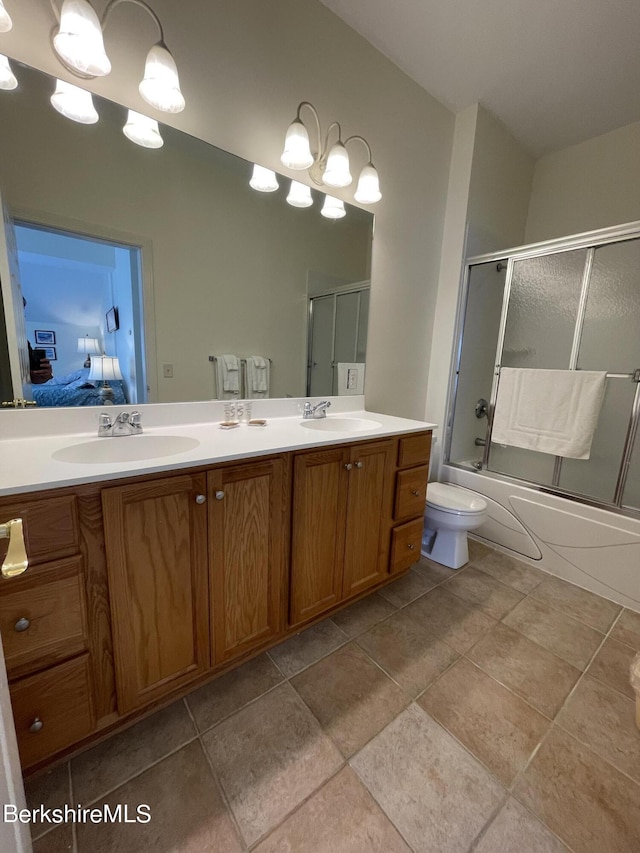 full bathroom with vanity, shower / bath combination with glass door, toilet, and an inviting chandelier