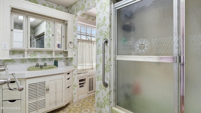 bathroom with wallpapered walls, tile patterned floors, and vanity