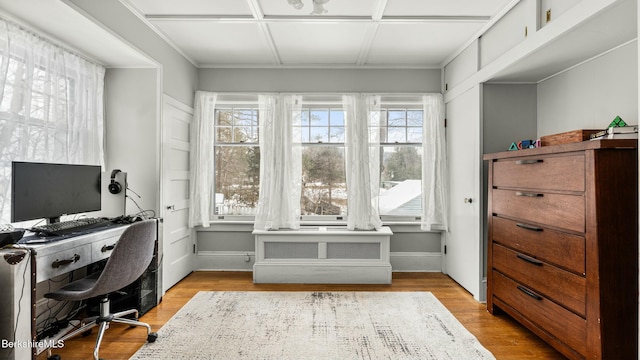 home office featuring light wood-style flooring and baseboards