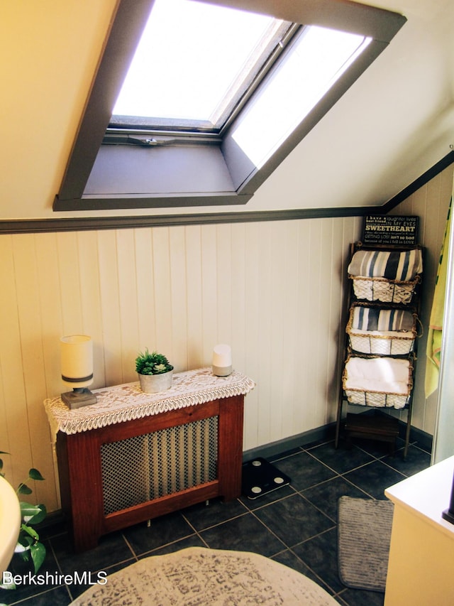 24 Turners Ave, Adams, MA 01220 - bathroom featuring a skylight, tile patterned flooring, and radiator heating unit