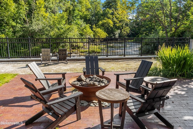 view of patio featuring a fire pit