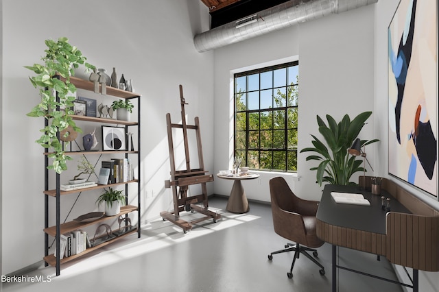 office space featuring concrete flooring