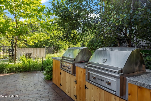 view of patio with grilling area and exterior kitchen