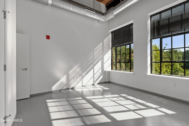 empty room featuring a high ceiling