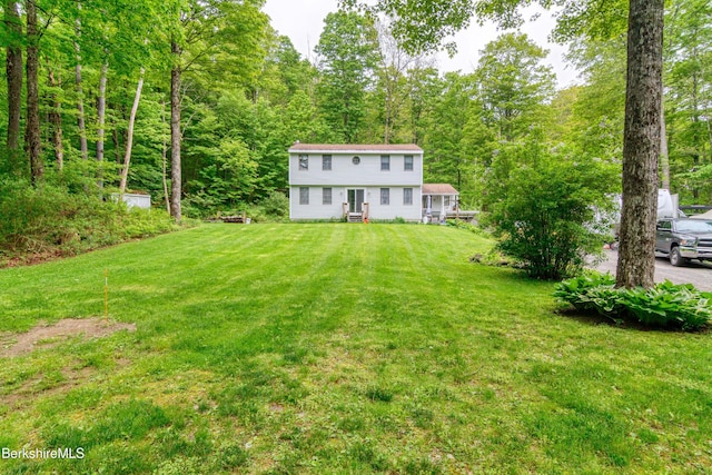 495 Williamstown Rd, Lanesborough, MA 01237 - view of green lawn featuring a wooded view and entry steps