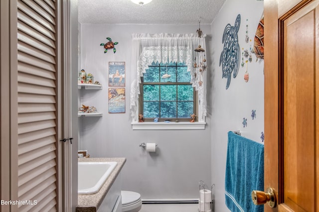 495 Williamstown Rd, Lanesborough, MA 01237 - half bath featuring a textured ceiling, a baseboard heating unit, toilet, and vanity