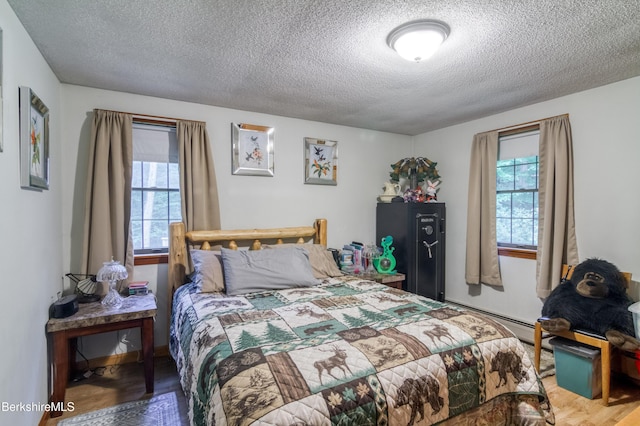 495 Williamstown Rd, Lanesborough, MA 01237 - bedroom with a textured ceiling and wood finished floors