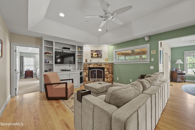 200 Easthampton Rd, Westhampton, MA 01027 - living area with a tray ceiling, a ceiling fan, light wood-style flooring, a fireplace, and recessed lighting