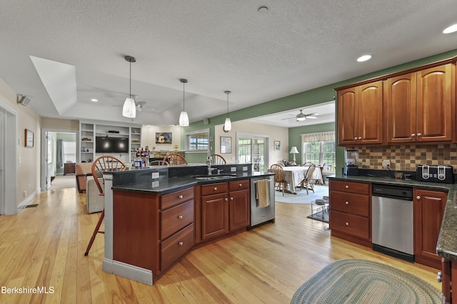 200 Easthampton Rd, Westhampton, MA 01027 - kitchen featuring ceiling fan, dishwasher, open floor plan, a breakfast bar, and light wood-style flooring