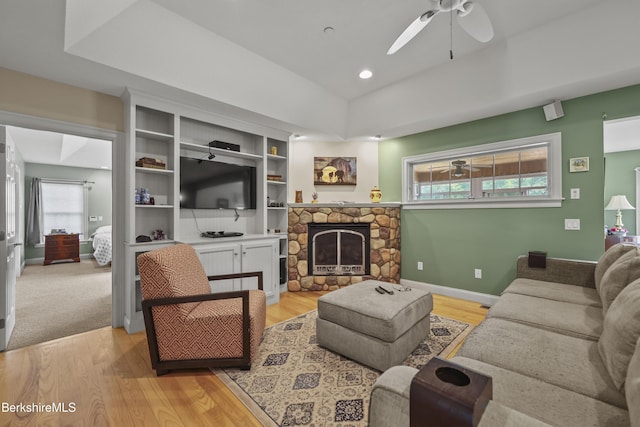 200 Easthampton Rd, Westhampton, MA 01027 - living room featuring a ceiling fan, light wood-type flooring, and a stone fireplace