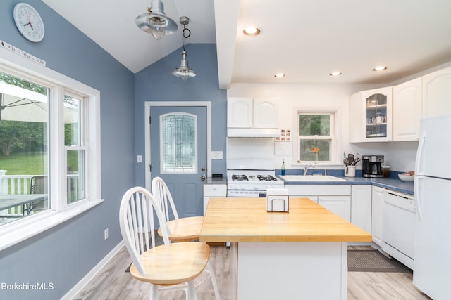 63 Yarmouth St, Pittsfield, MA 01201 - kitchen featuring white appliances, white cabinets, plenty of natural light, vaulted ceiling, and recessed lighting