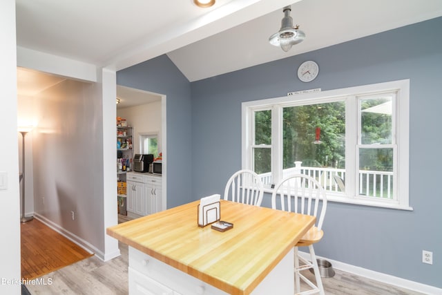 63 Yarmouth St, Pittsfield, MA 01201 - dining area with light wood-style flooring and vaulted ceiling