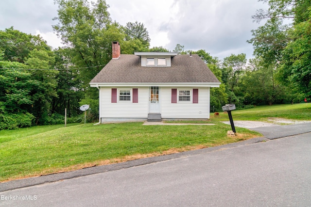 63 Yarmouth St, Pittsfield, MA 01201 - bungalow-style house with a front yard and a chimney
