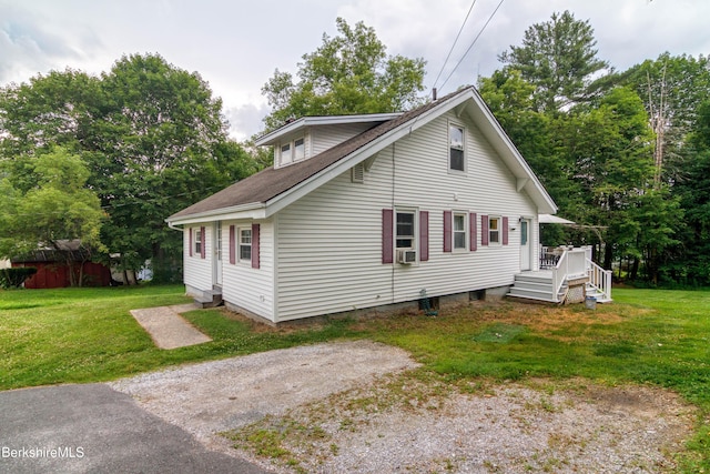 63 Yarmouth St, Pittsfield, MA 01201 - view of front of property featuring a front yard, a deck, cooling unit, and roof with shingles