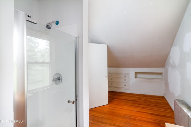 63 Yarmouth St, Pittsfield, MA 01201 - full bathroom featuring radiator, a walk in shower, hardwood / wood-style floors, and lofted ceiling