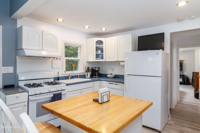 63 Yarmouth St, Pittsfield, MA 01201 - kitchen with white appliances, under cabinet range hood, white cabinetry, glass insert cabinets, and recessed lighting