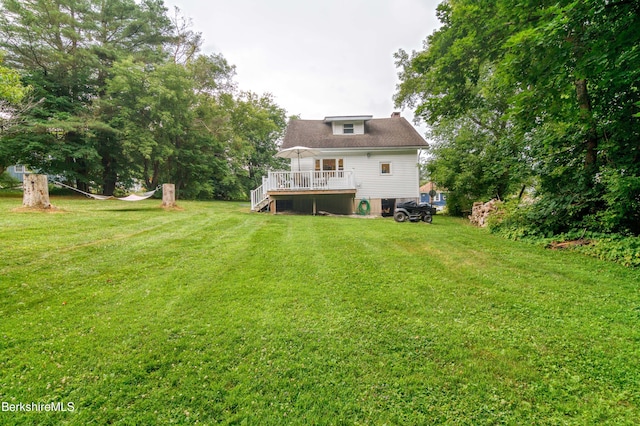 63 Yarmouth St, Pittsfield, MA 01201 - back of property featuring a deck, a yard, a chimney, and stairway