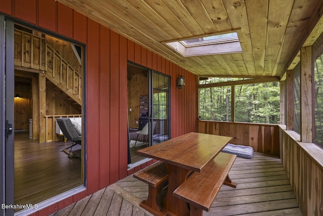 26 Autumn Ct, Otis, MA 01253 - sunroom / solarium with a skylight, wood-type flooring, wooden walls, wood ceiling, and a wooden deck