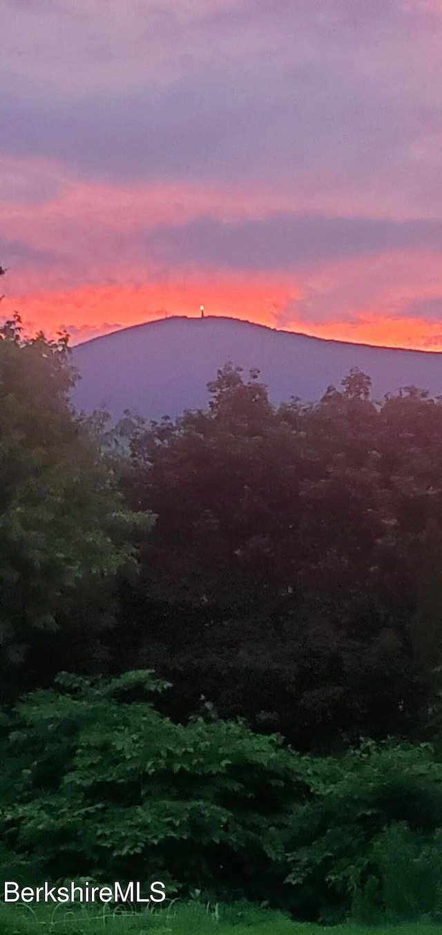 nature at dusk featuring a mountain view