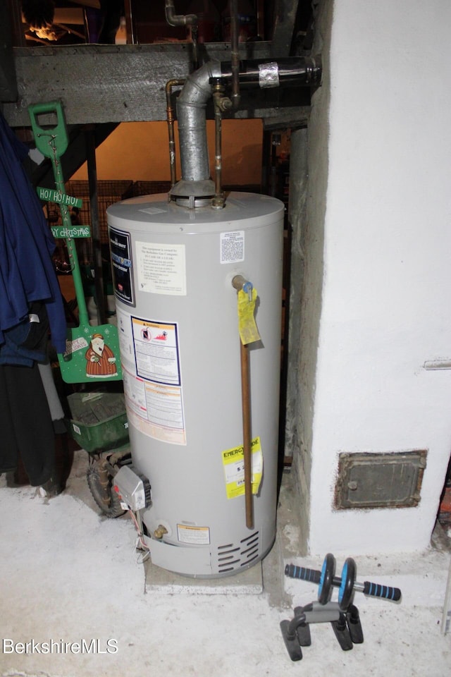 utility room featuring water heater