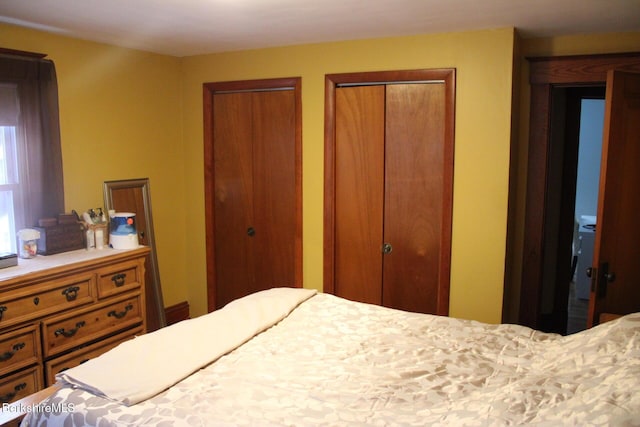 bedroom featuring multiple closets