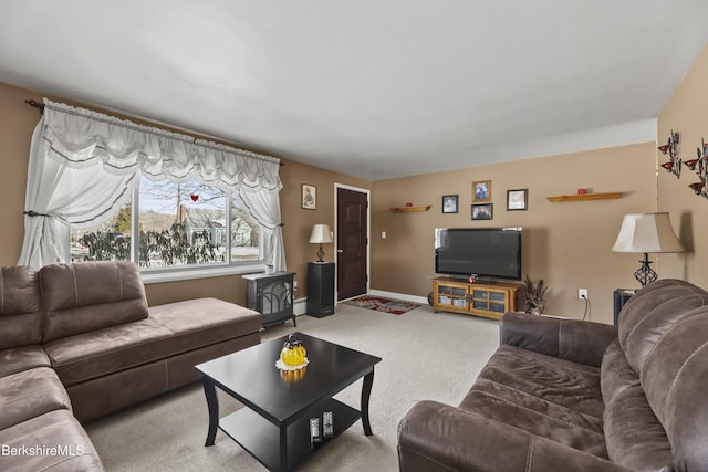 living area featuring baseboards and light colored carpet