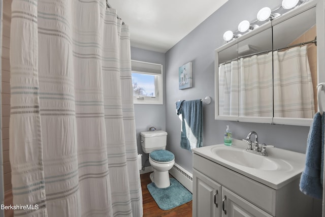 full bathroom with a baseboard heating unit, toilet, wood finished floors, and vanity