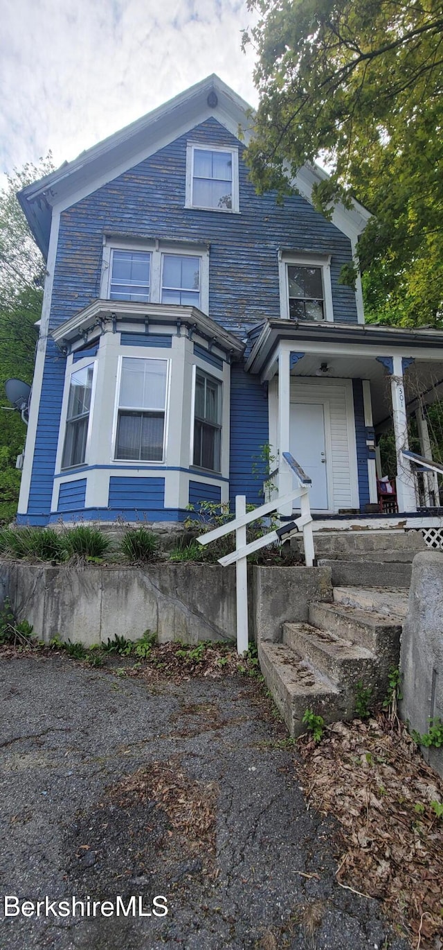 301 Walnut St, North Adams, MA 01247 - view of front facade featuring a porch