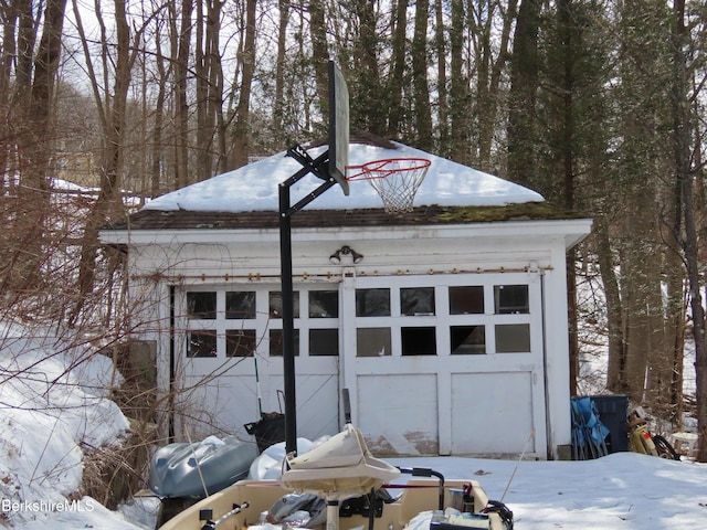 view of snow covered garage