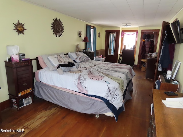 bedroom with wood finished floors