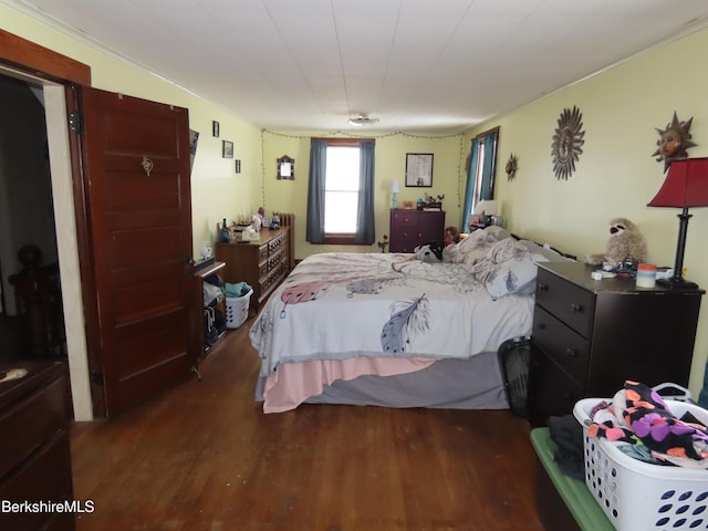 bedroom featuring wood finished floors