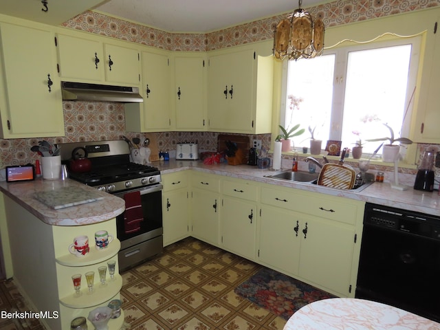 kitchen with gas stove, a sink, light countertops, black dishwasher, and under cabinet range hood