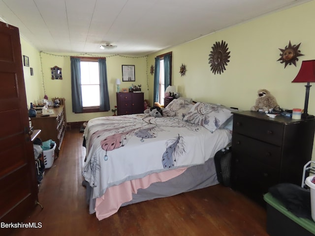 bedroom with wood finished floors