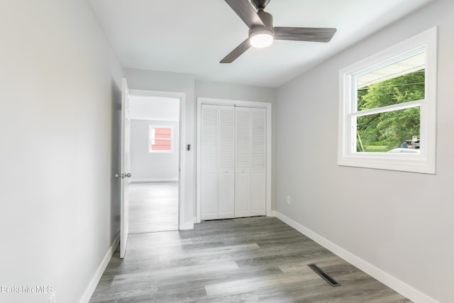 3 Burke Ave, Pittsfield, MA 01201 - unfurnished bedroom with wood finished floors, a closet, and a ceiling fan