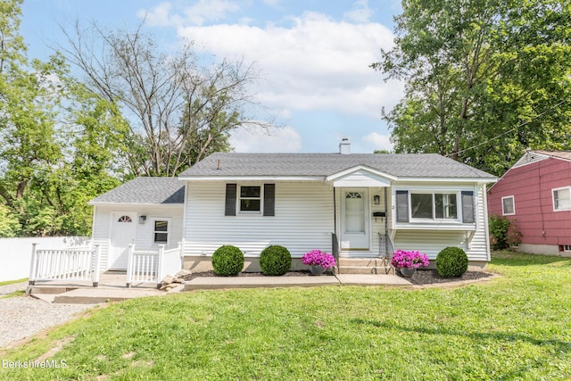 3 Burke Ave, Pittsfield, MA 01201 - view of front of home featuring a front yard, a shingled roof, and a chimney