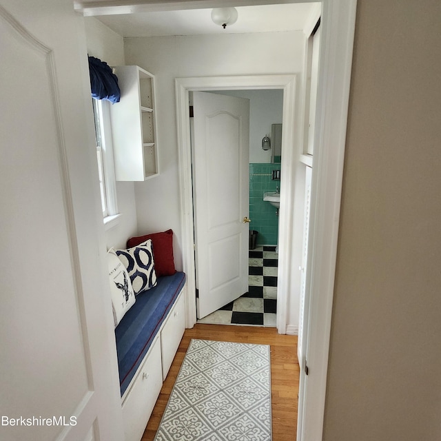 377 Pomeroy Ave, Pittsfield, MA 01201 - hallway with wood finished floors and tile walls
