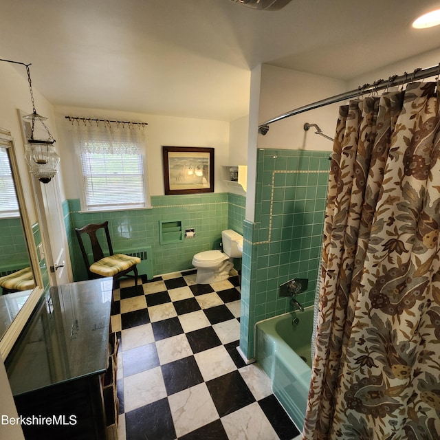 377 Pomeroy Ave, Pittsfield, MA 01201 - bathroom with tile walls, shower / tub combo with curtain, a wainscoted wall, radiator heating unit, and tile patterned floors