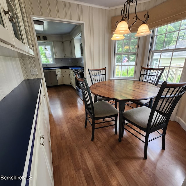 377 Pomeroy Ave, Pittsfield, MA 01201 - dining space featuring dark wood-style floors, wallpapered walls, and ornamental molding