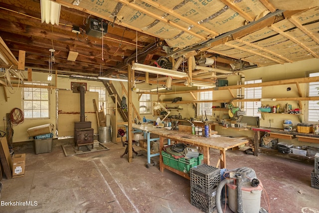 220 N Plain Rd, Great Barrington, MA 01230 - basement with a workshop area and a wood stove