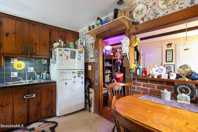 53 Mahaiwe St, Great Barrington, MA 01230 - kitchen featuring freestanding refrigerator, light flooring, backsplash, and dark countertops