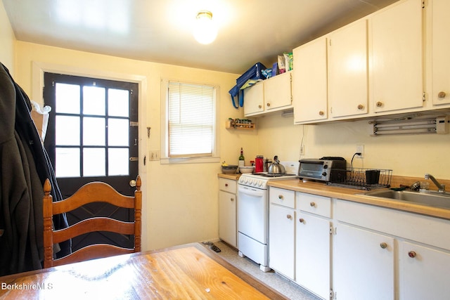 53 Mahaiwe St, Great Barrington, MA 01230 - kitchen featuring white electric range oven, light countertops, and white cabinetry