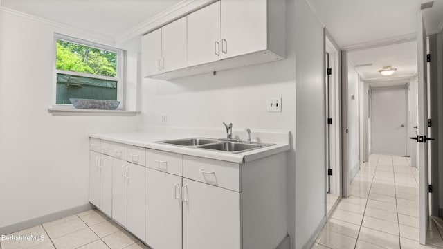 22 Delafield Dr, Lenox, MA 01240 - kitchen featuring light tile patterned floors, light countertops, white cabinetry, and crown molding