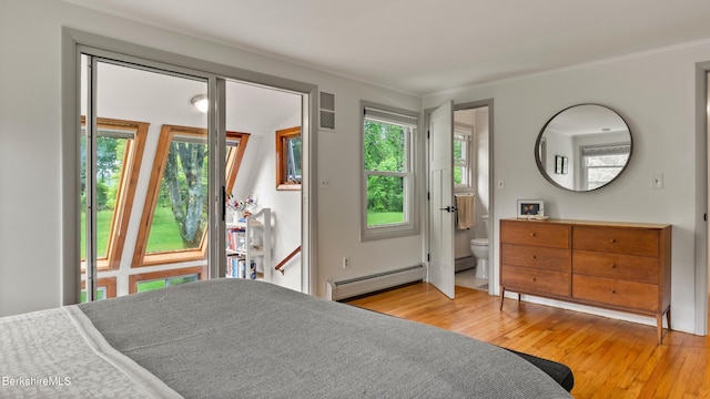 22 Delafield Dr, Lenox, MA 01240 - bedroom featuring a baseboard heating unit, hardwood / wood-style floors, and connected bathroom