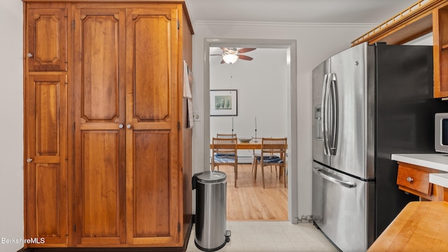 22 Delafield Dr, Lenox, MA 01240 - kitchen featuring stainless steel fridge with ice dispenser, ceiling fan, brown cabinets, crown molding, and wooden counters