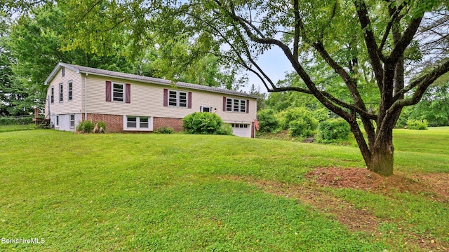 22 Delafield Dr, Lenox, MA 01240 - raised ranch featuring an attached garage and a front lawn